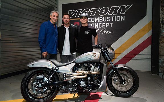 Cory Ness, Zach Ness and Max Ness post with the Victory 'Combustion' concept bike that Zach Ness built.