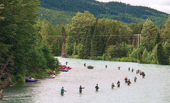 Anglers flank the Kenai River in search of salmon. 