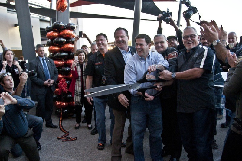 The big scissors took center stage as dignitaries joined owner Bob Parsons in the official ribbon cutting during the dealership’s grand opening