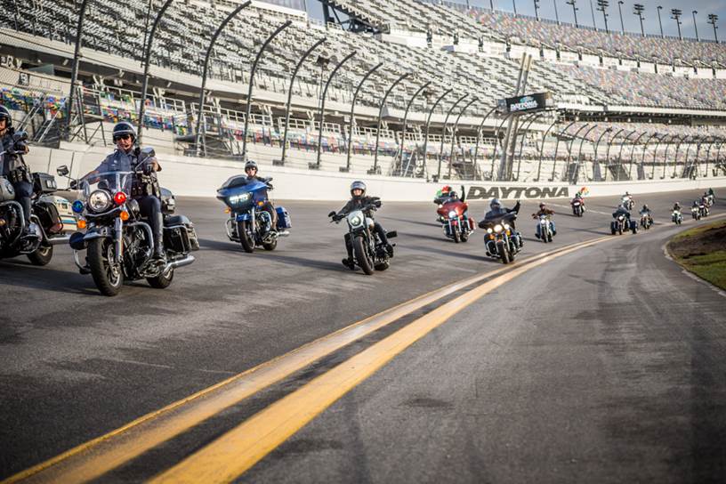 Harley-Davidson takes a group of military personnel and first responders on a ride around Daytona International Speedway.