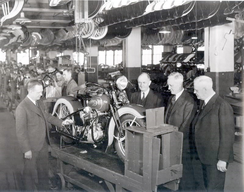 Maybe that turned out to be a blessing in disguise, for reasons we’ll get into in the next installment. For now, it’s enough to know that H-D never again used more than a fraction of the factory’s potential production volume until World War II broke out! Even as late as 1936, and the advent of the OHV 61 (Knucklehead to us), the assembly line was still a series of manned benches, not much sign of automation, because it simply wasn’t needed. We’ll talk about what was needed for Harley’s survival… next time.