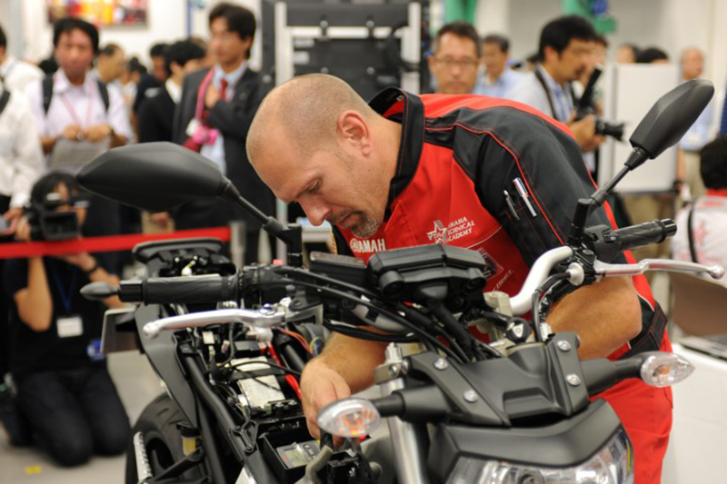 David Speeks of Houston Motorsports troubleshoots a 2014 FZ-09 during the practical test at the 2014 Yamaha World Technical Grand Prix. (Photo: Yamaha)