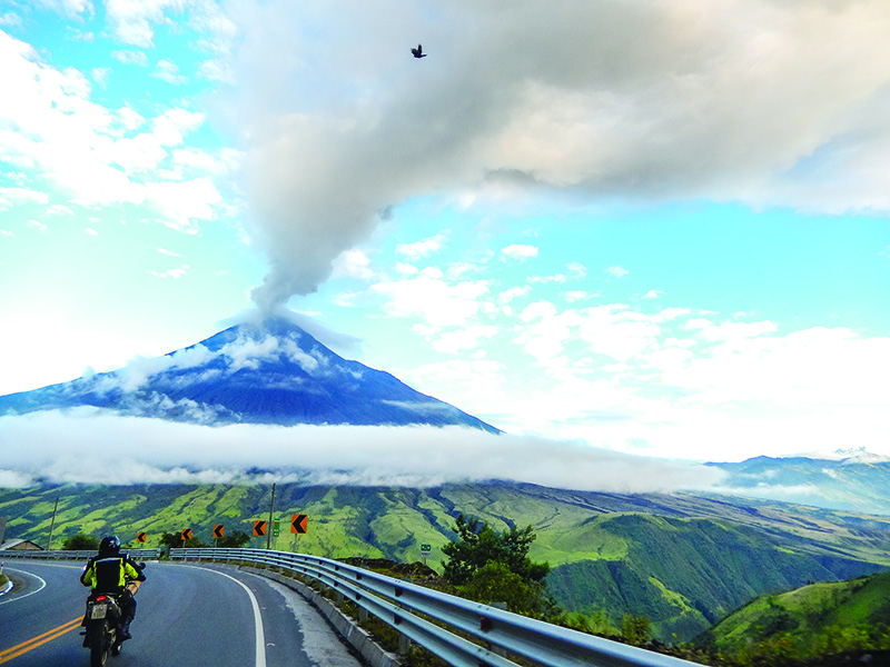 Riding around the base of 16,480-foot Tungurahua on our way to Baños.