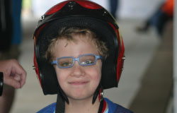 Ride for Kids Star Dylan tries on a helmet before the N.C. Triangle event. (Photo: Ride For Kids)