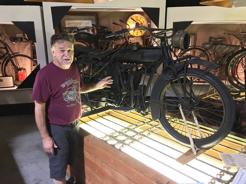 Dale Walksler pointing out the unique features the motorcycle that belonged to Oscar Hedstrom, Indian Moto(r)cycle's co-founder and first engineer.