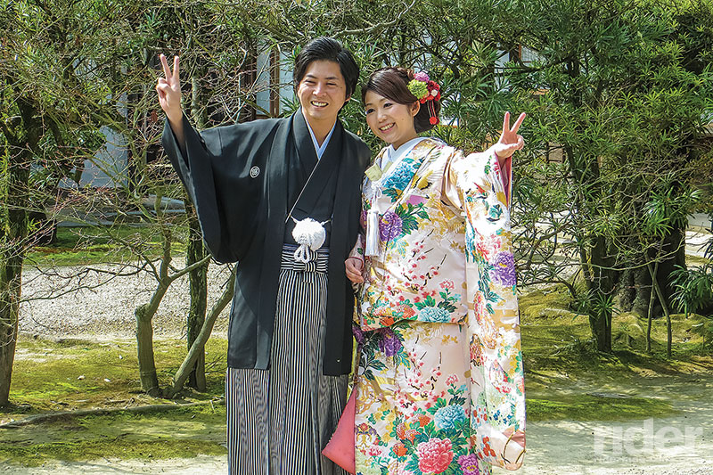 Couple in Korakuen Gardens in Okayama wearing traditional garb, presumably celebrating their betrothal.