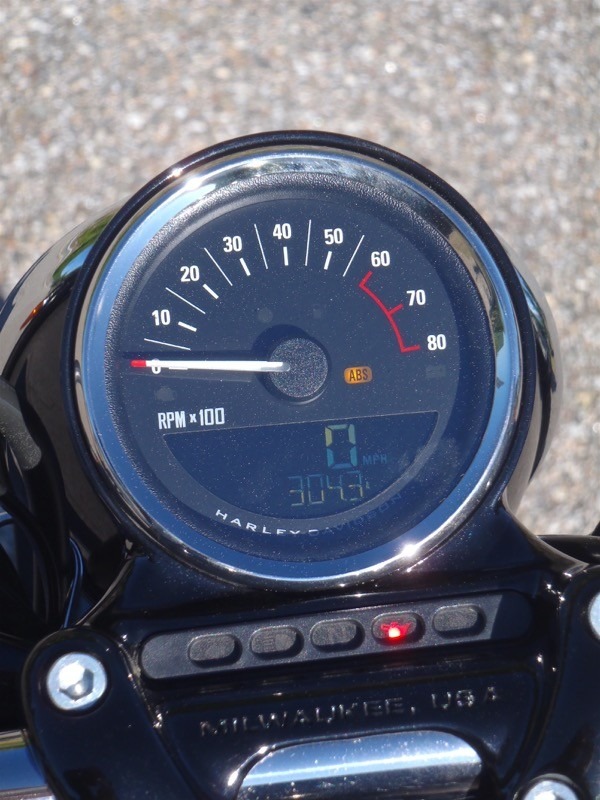 The instrument cluster is only 4 inches in diameter and the warning lights are integrated into the handlebar clamp—very clean design