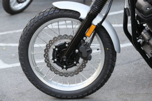 Spoked aluminum rims (19-inch front, 17-inch rear) are shod with Bridgestone Battle Wing tires with a special block tread pattern, and they carry tubes.