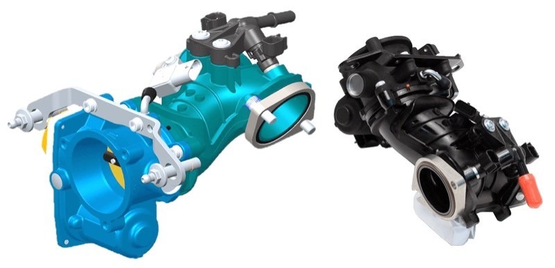 Here we see two images of the new 55mm, two-piece induction module. The fuel injectors you see in black on the blue picture, which are indexed in the manifold, have a dual-spray pattern, to ensure that each of the two intake ports receives its own properly metered “spray.” The MAP (manifold air pressure) input sensor for the ECM plugs into the white connector, pictured on top of the manifold. And, yes, the black module in the picture, as fitted to the M-8 engines, is made of plastic to save weight. This has raised an eyebrow or two, but modern plastics can take as least as much abuse and heat as aluminum, as well as being a more accurately made part.