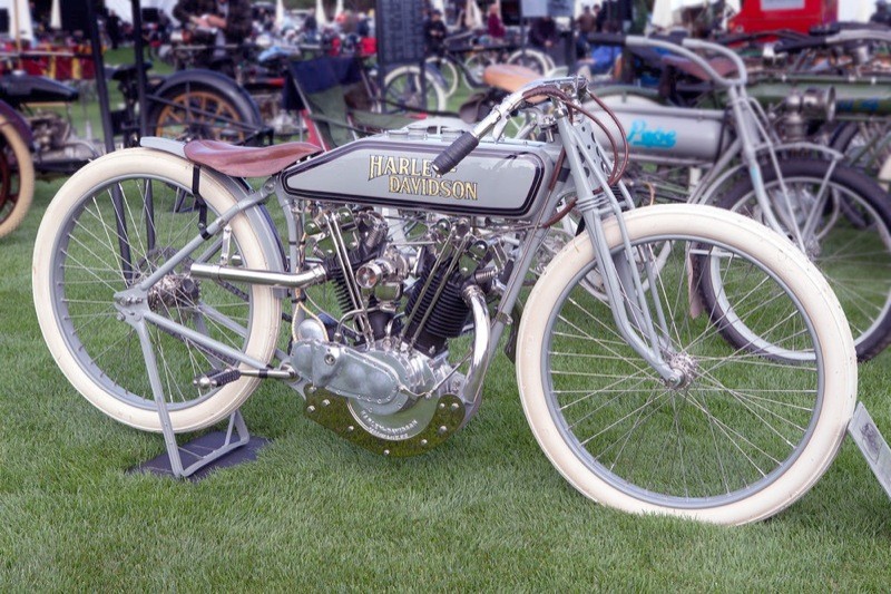 Meanwhile, Harley-Davidson waited until everyone else in the game had shown their cards, then sprung this on them! The 1916 8-valve model literally took the racing world by storm! But the storm passed too quickly! After kicking butt for a season, the 8-valve was heard no more until 1919 and the resumption of racing. (We’re going to get into that next month.) But for now it might be instructive to take a look at a few details. First, the Harley’s 8-valves operate differently than the Indians (picture 2) by lining exhaust valves up fore and aft, while the Indian’s are oriented side-to-side. The original is also the only 8-valve H-D to use exhaust pipes... four of them... one on each of four round ports. Last (for now) there’s the fork... which looks like all the other forks on all the other bikes. That wouldn’t last because in the same way the engine evolved over the next 13 years, so did the frame and forks. As you’ll see... next issue!