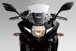 The Suzuki GSX250R's halogen headlight is flanked by LED position lights.