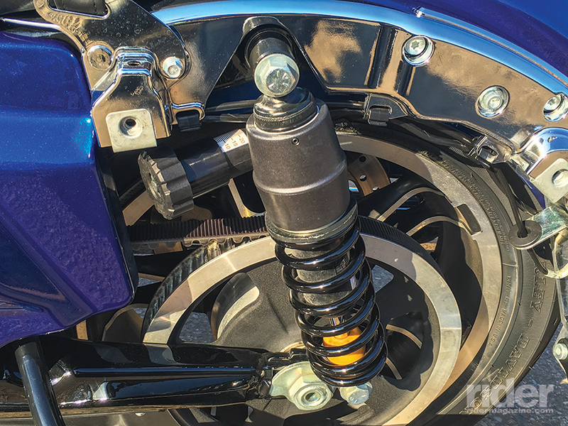 Removing the left saddlebag reveals the preload adjuster knob on the new "set and forget" Showa rear shocks.