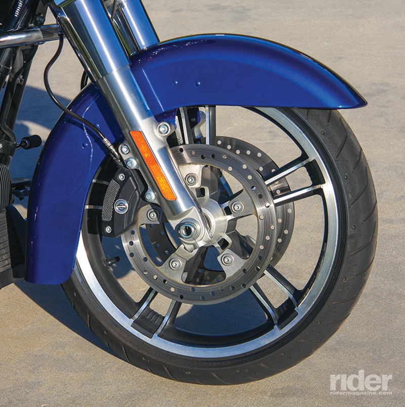 A low-profile fender wraps around a 19-inch Enforcer cast wheel. Reflex Linked Brakes with ABS are optional.