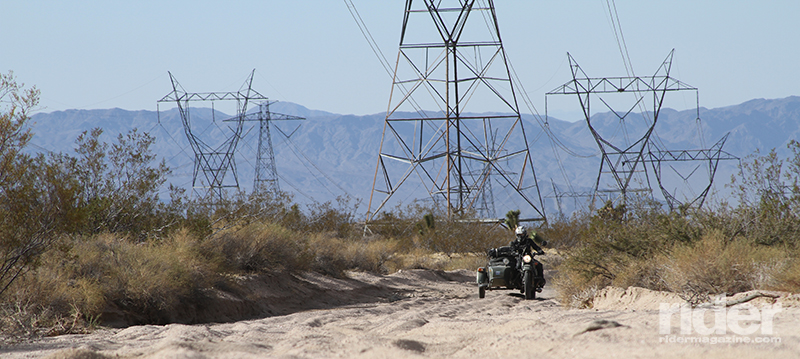 Dual-sport or adventure riding in the southwestern United States requires basic sand riding experience at minimum, as even major power line roads like this one can have sandy surprises waiting just over the next rise.