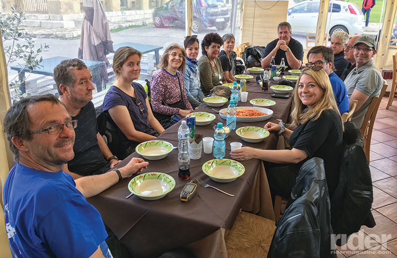 Our group waits patiently for me to take a photo before tucking into a delicious lunch of homemade pasta in Ficuzza. 