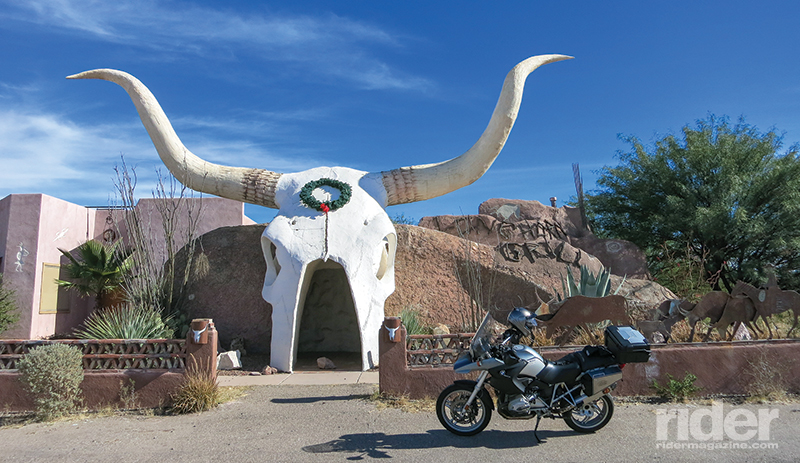 That giant steer skull is the entrance to an isolated roadside saloon near the Mexican border.