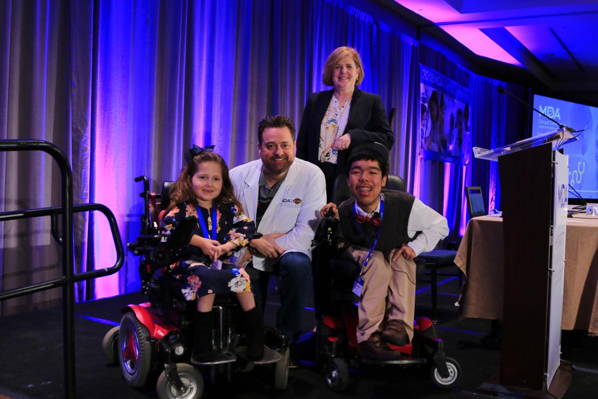 Milwaukee-based Harley-Davidson, Inc. was honored with a special award during the 2018 MDA Clinical Conference in Arlington, VA on Monday, to recognize the company’s fundraising efforts for MDA’s research program. Left to right: MDA National Ambassador Faith Fortenberry, Harley-Davidson Director of Government Affairs Ed Moreland, MDA President and CEO Lynn Vos and MDA National Ambassador Justin Moy.