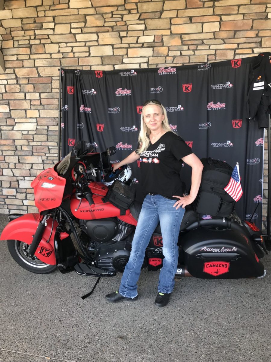 Faith, on her Indian Chieftain Dark Horse, is posing for pictures before she meets all the fans that showed up to the event