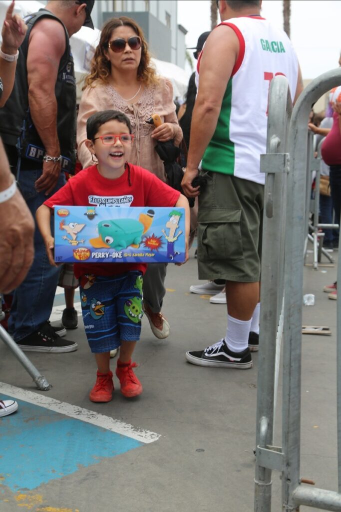 A young boy was beaming with joy after receiving his toy