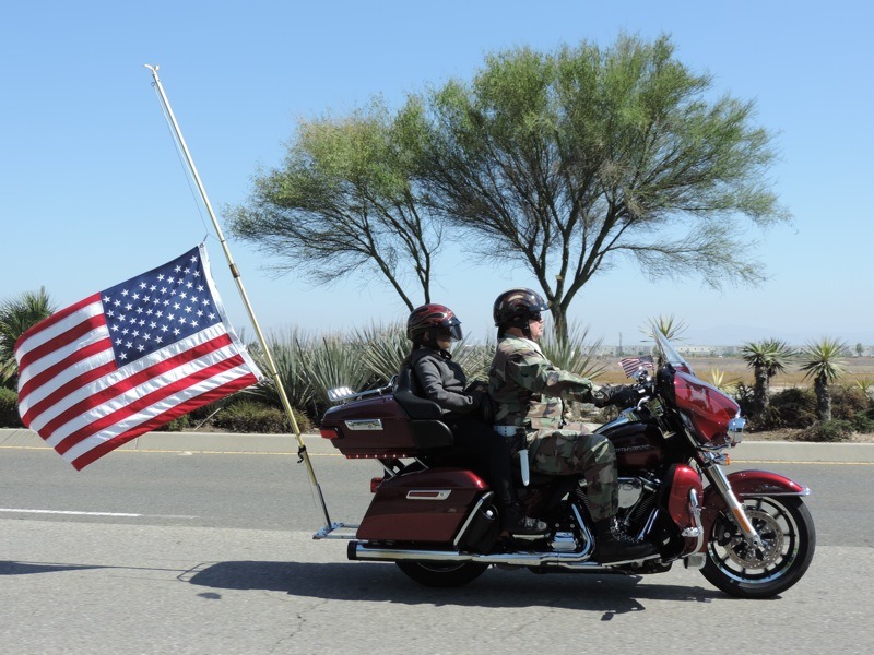 WCT Honor Guard Jim Bridges and his 10-year-old granddaughter, Jessyka Tate presenting the American flag at half mast in honor of all of our fallen heroes