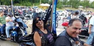 Sherri Dove readies herself for the parade of flags that culminated the Iron Adventure rally
