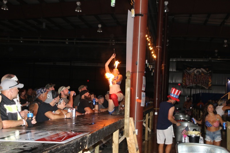 Fire-eating girl at Coal Bucket Saloon