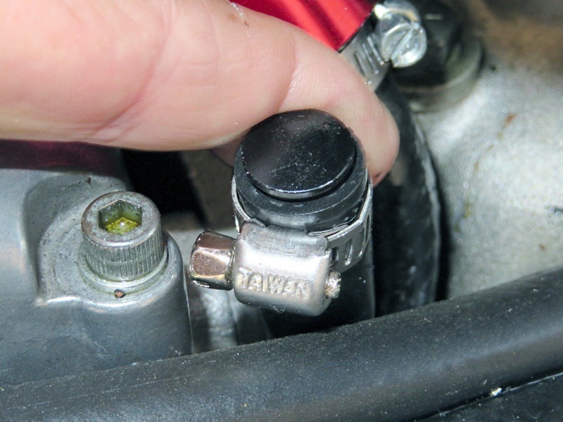 If you read last month’s Motorhead Memo, you’ll recall that all this started with a change to an S&S reed breather valve, because the standard rotating breather has more shortcomings than advantages. Turned out that the reed has one major drawback… it won’t draw back! Any drawback from any breather setup is based on air pressure and vacuum, or more precisely, any pressure differential at a given point in crankshaft rotation. So began a quest for another way to control that. Based on the illustration in last month’s column, here’s the first step… disconnect the so-called oil tank vent line from the cam case nipple and plug it.