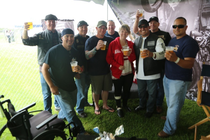 Back in the VIP tent, a mix of veterans enjoyed a cold beer with war hero Holly Katke
