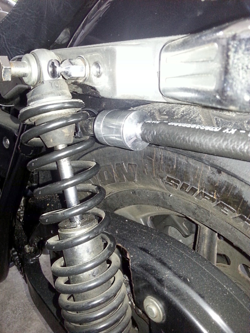 Way upstream and clear towards the back of the bike (for now) is the current “exhaust/outlet” valve… which happens to be a Doherty donated by my friend Paul. (Any number of similar high-quality options exist for this application.) Don’t be tempted to use an automotive PCV valve… they can’t handle the pulsations of a V-twin. What’s worth noting, but not visible, is the treatment of the hose that runs from the valve to the back fender tip… set as a 12” “draft” tube with a 45-degree cut at the end. So effective that you shouldn’t even consider not using one. That said, consider routing the valve and the tube under the bike...not the fender. My current setup will be redone that way in due course.
