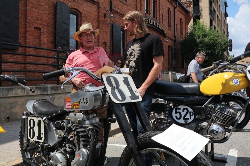 Ryan Tickle listening to this old timer describe his AJS powered race bike