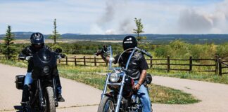 Dave Roe from V-Twin Visionary on the 2020 Low Rider S and Kent Prentiss of Radflagz on his custom chopper outside of Durango, Colorado. A sign of the times with a forest fire burning in the background.