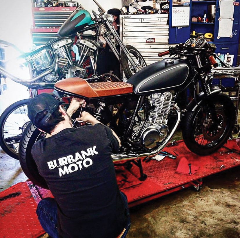 Ritchie from Wilder Factory installs one of his seats on our SR400 build.