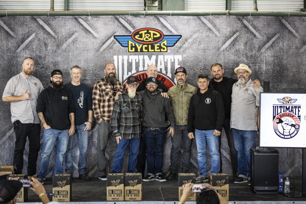 All winners from 2021 J&P Cycles UBCBS stand with each other in front of J&P logo