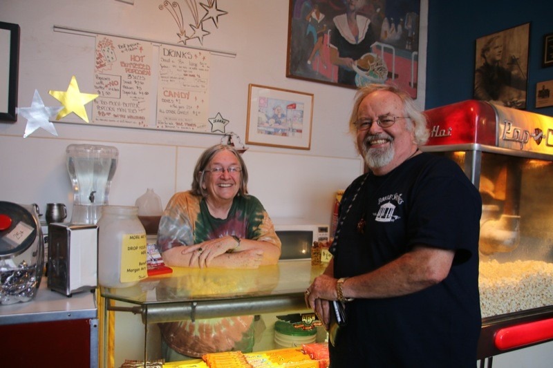 Jeanne Mozier, proprietor of the Star Theatre, prepares to serve popcorn to a customer
