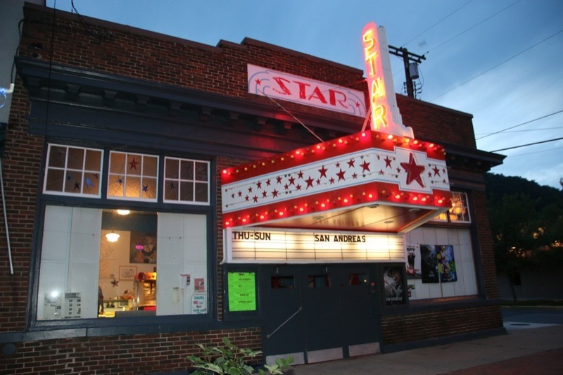 Jeanne Mozier, proprietor of the Star Theatre, prepares to serve popcorn to a customer