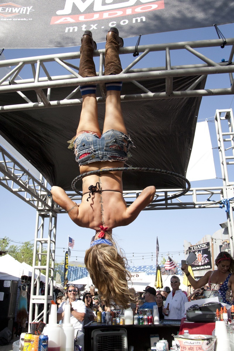 In between slinging suds, bartenders entertain the masses with cool tricks like upside down hula hooping while blowing a whistle