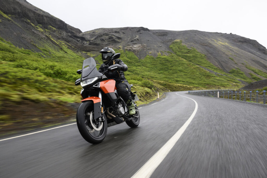 Norton Atlas cornering on a winding road during a motorcycle test