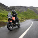 Norton Atlas cornering on a winding road during a motorcycle test