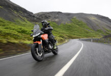 Norton Atlas cornering on a winding road during a motorcycle test