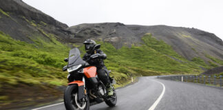 Norton Atlas cornering on a winding road during a motorcycle test