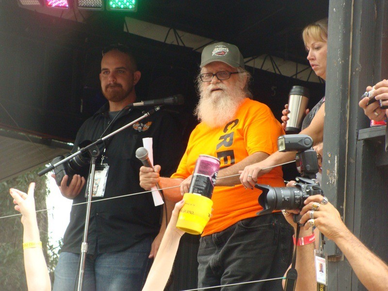 Roscoe takes the stage to make some announcements to the raucous crowd