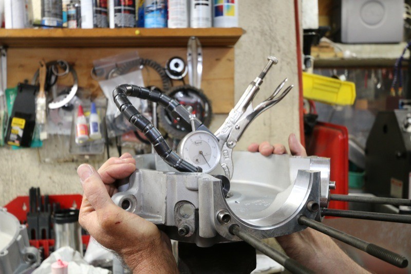  Using a dial indicator & dummy crank tool,  Ken checks the left-side Timken bearings for clearance