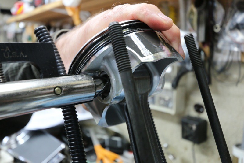 Ken uses a Harley tool specifically designed to install the piston circlip into the piston