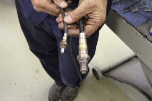 Note the difference between the stock 12mm narrow-band oxygen sensors (left) and the ThunderMax 18mm wide-band sensors