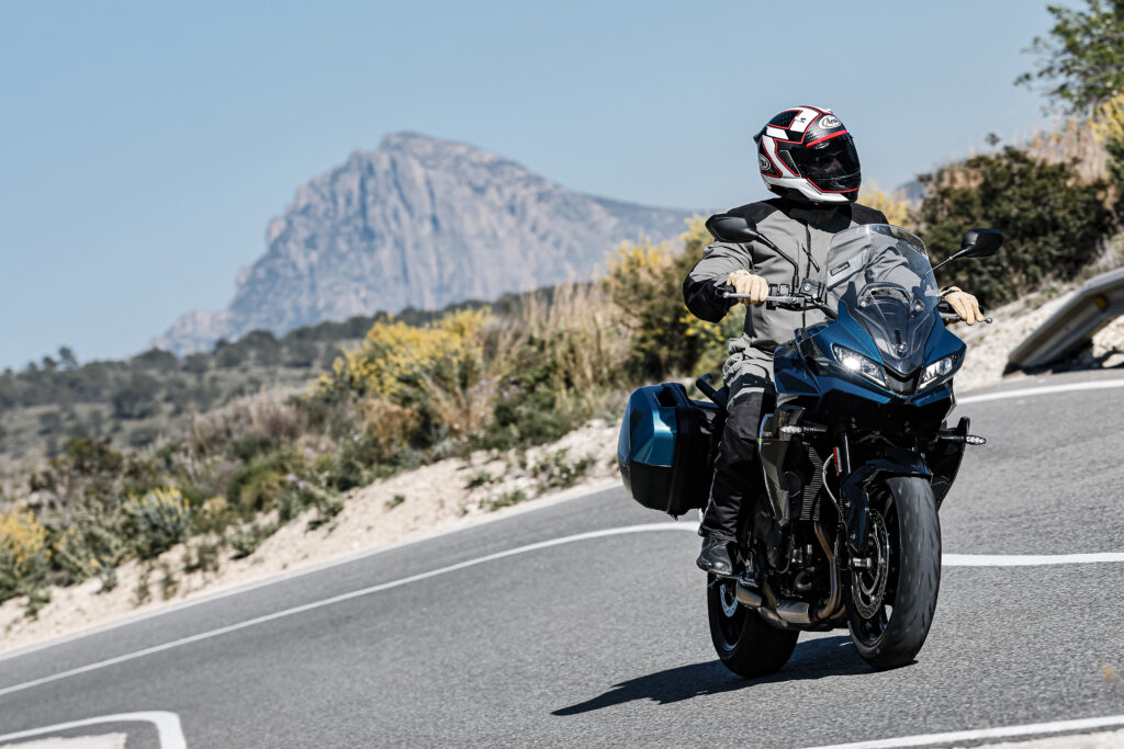 Riding a twisty paved road on a sport-touring motorcycle